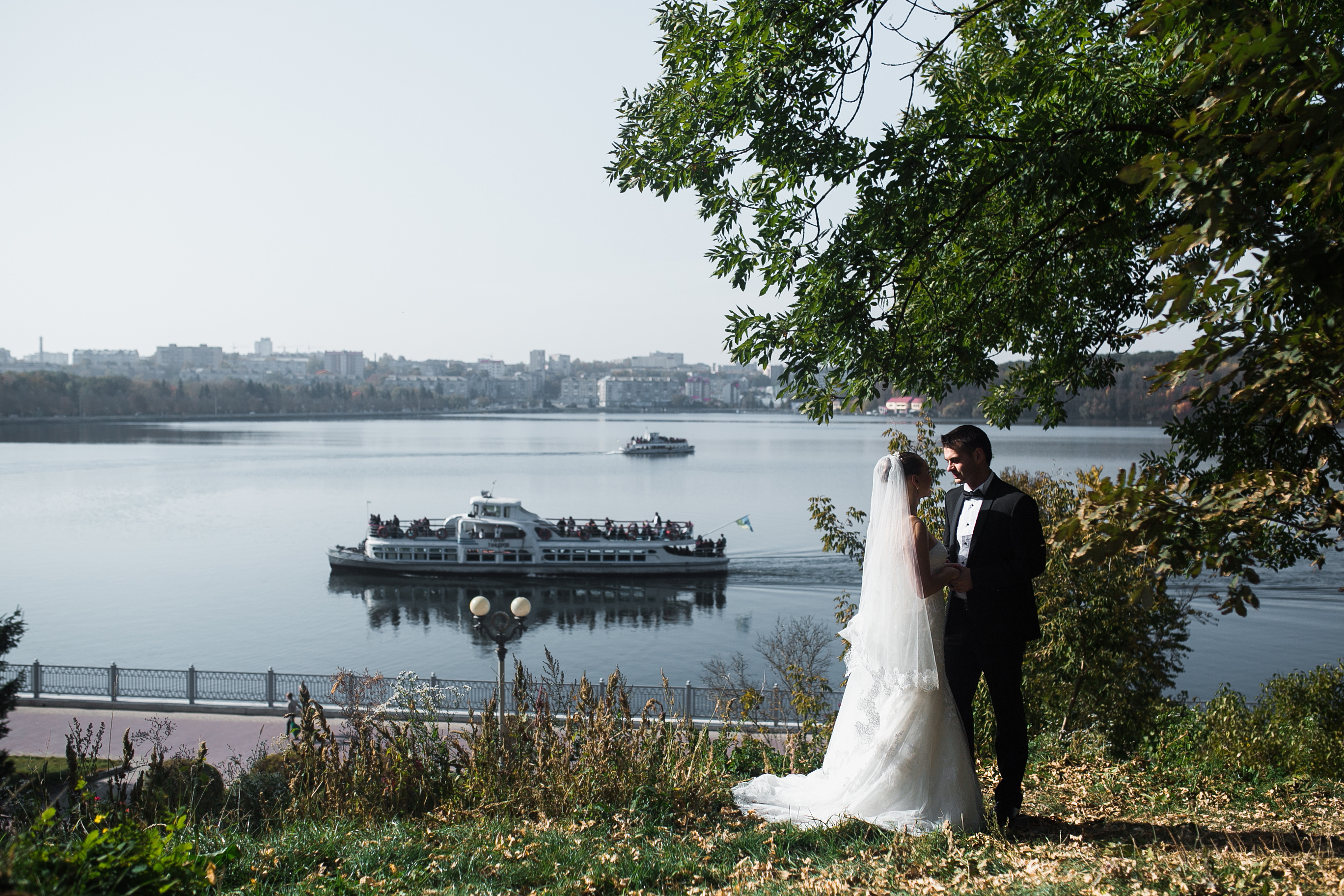 Photo of Bride and Groom Near Lake