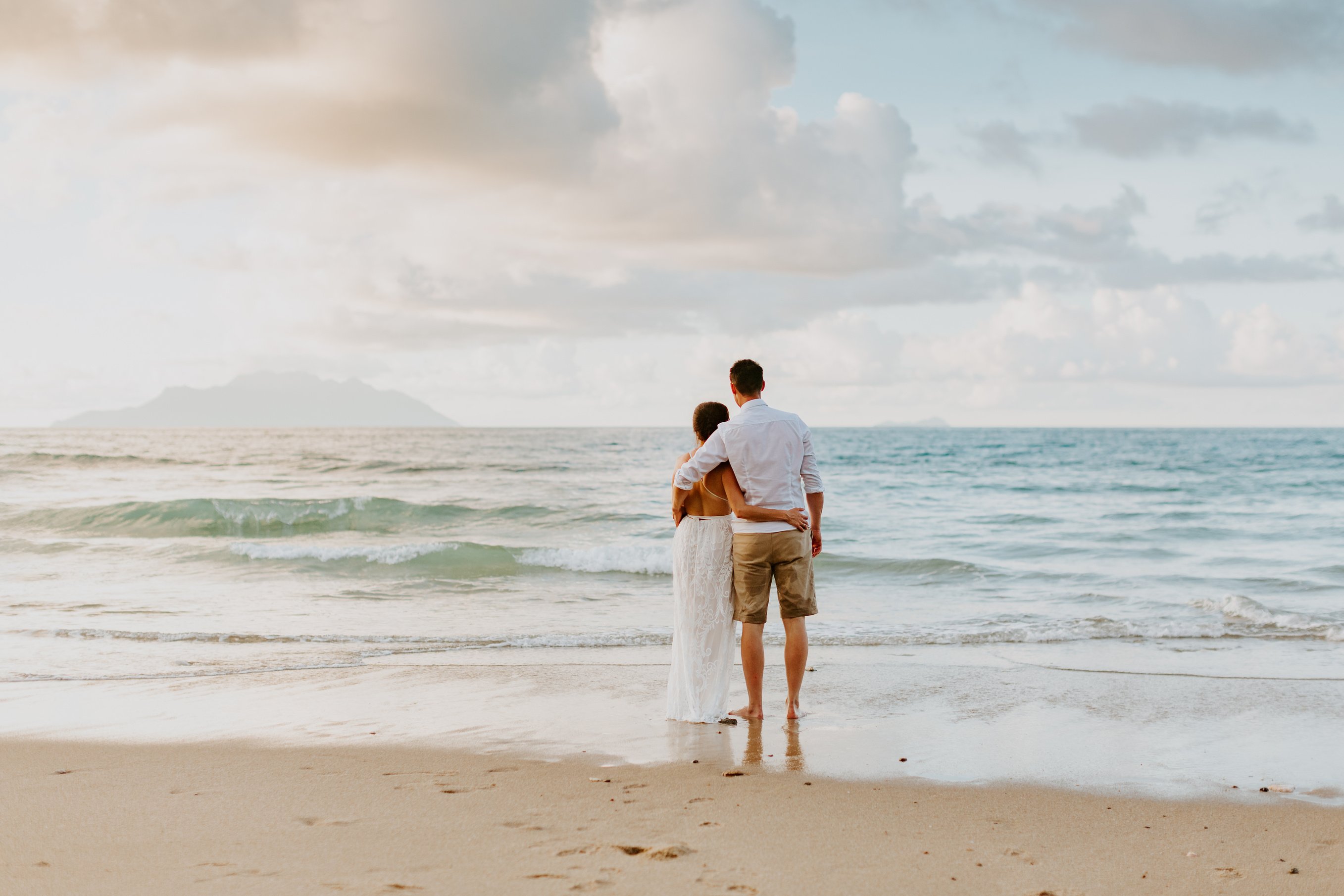 Newlywed Couple Walking on the BEach