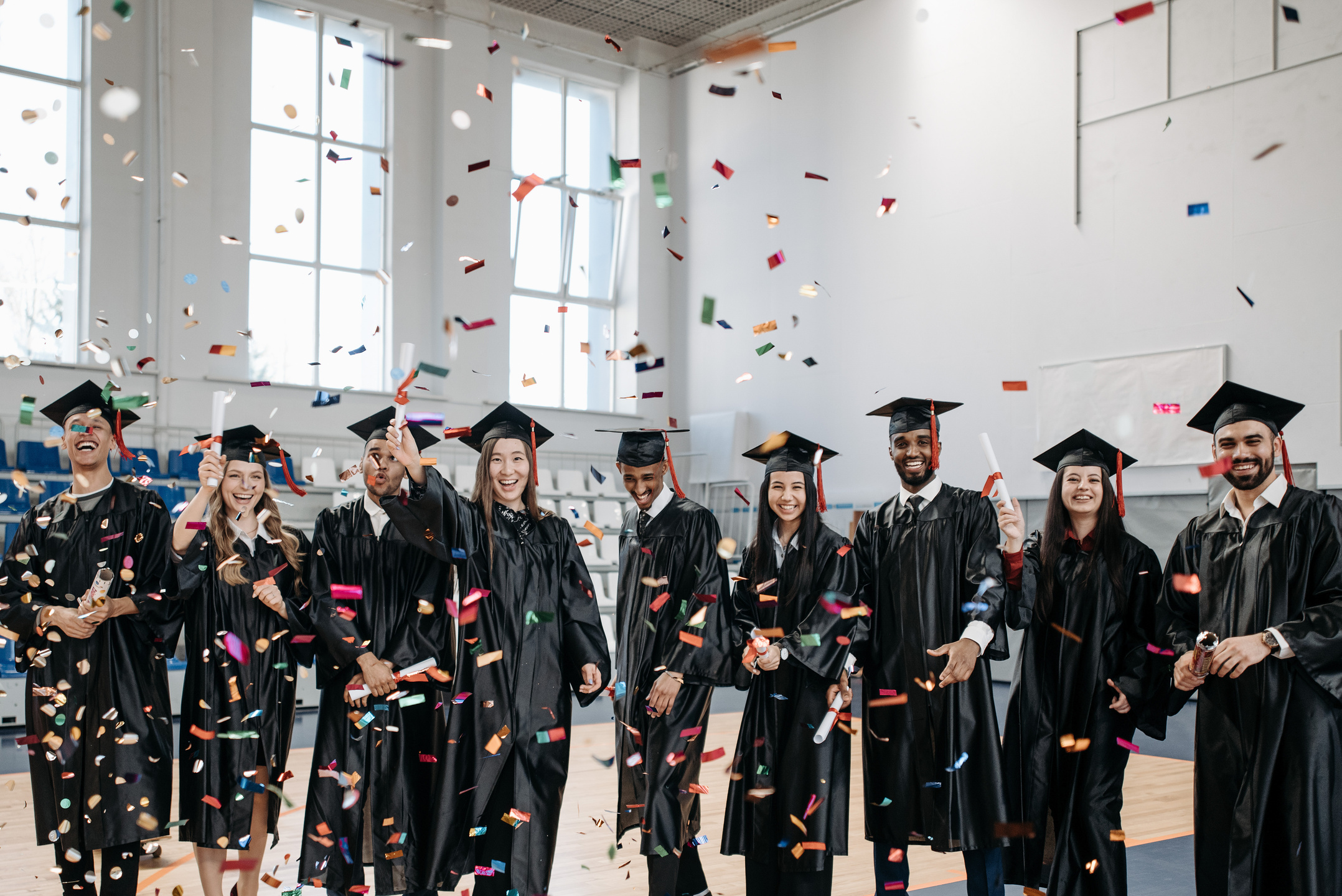 Photo of Fresh Graduates Celebrating in Gym 