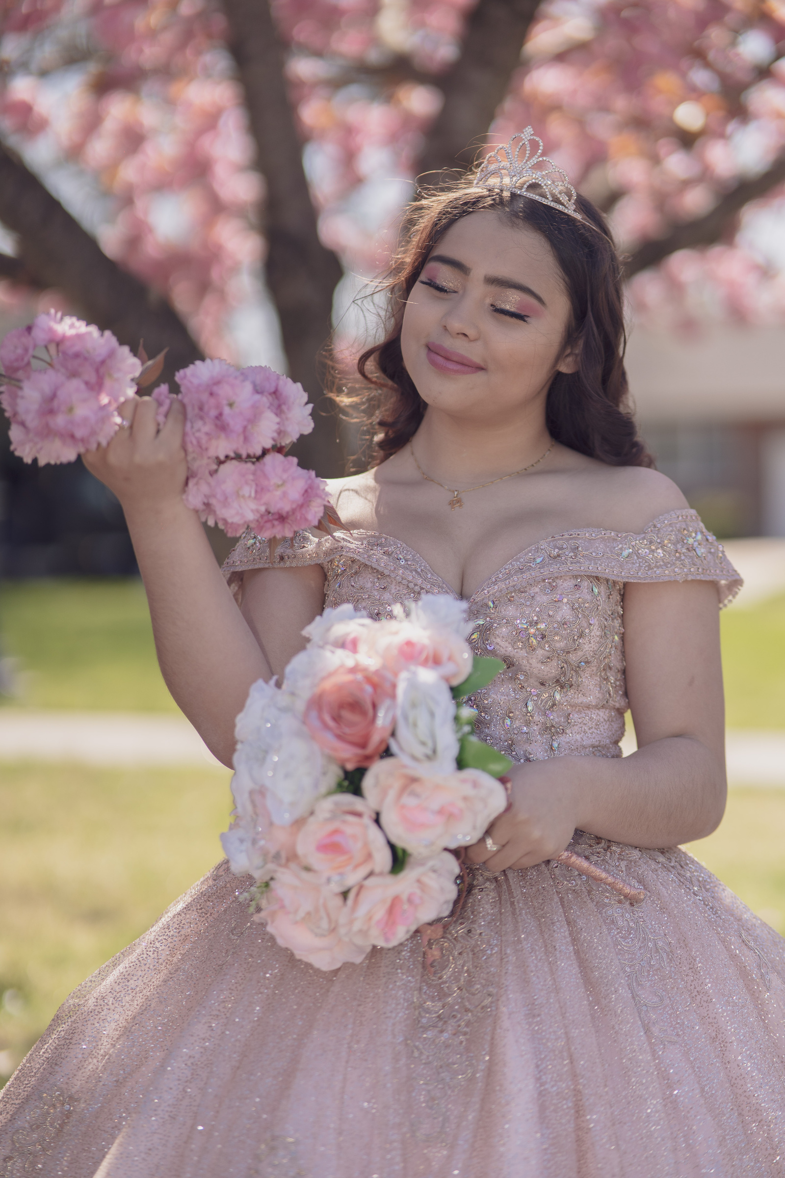 A Teenage Girl in Pink Gown Holding Bouquet of Flowers